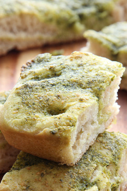 Lush green Pesto Focaccia with fresh basil pesto, ideal for an elegant Italian meal.