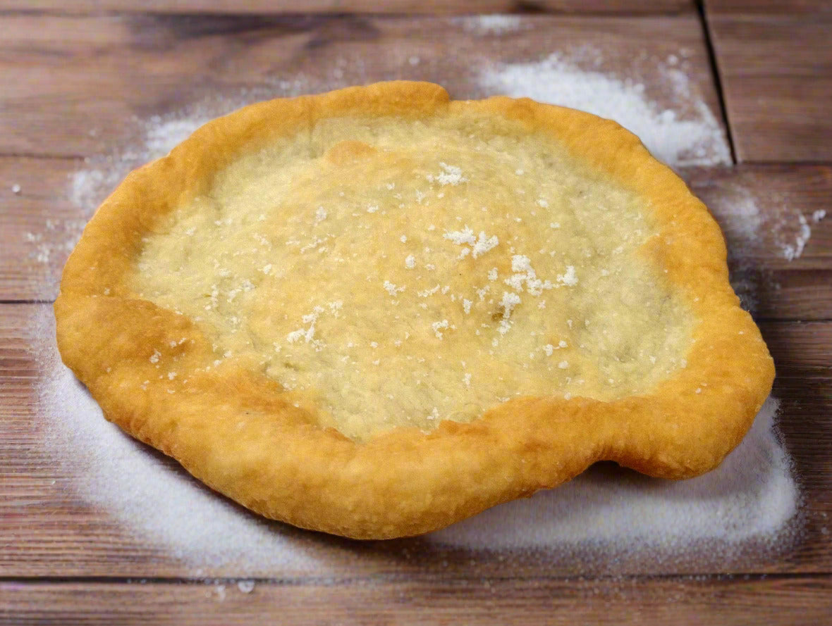 Freshly fried plain pizza with a golden, crispy crust and soft center, served hot from BAKI Bakery